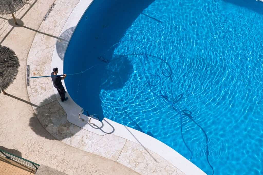 A swimming pool being professionally cleaned
